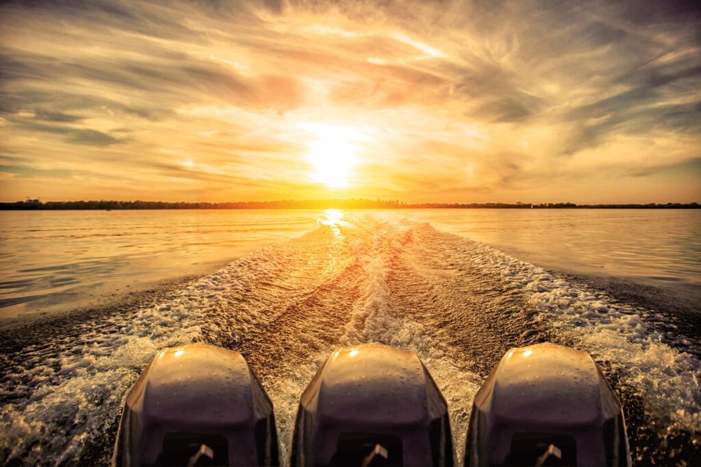 outboard motors at sunset