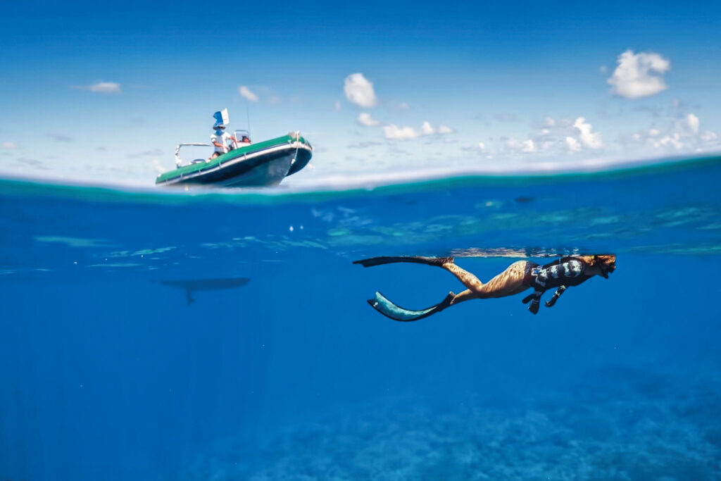 snorkeling under a boat tender