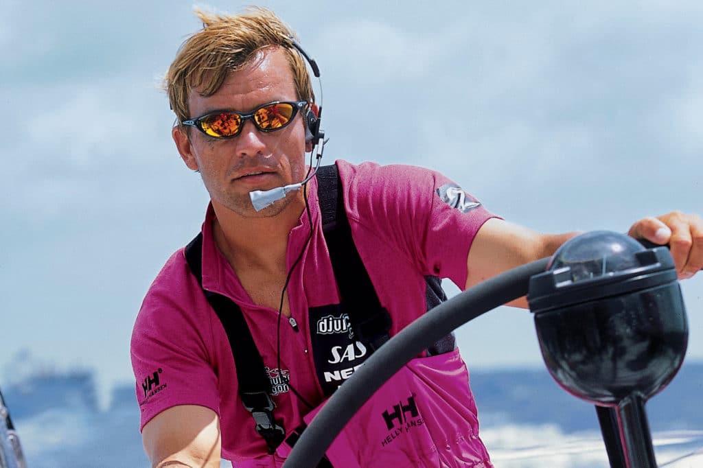 Knut Frostad at a boat's helm