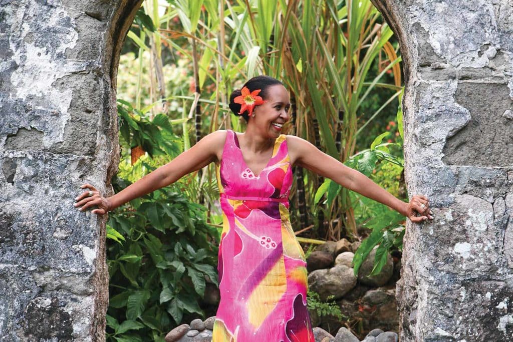 woman posing under archway