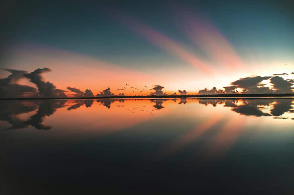 Sunset rays over water